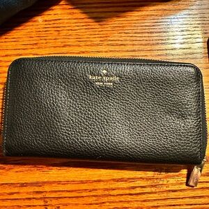kate spade black pebbled leather zip-around wallet with gold logo